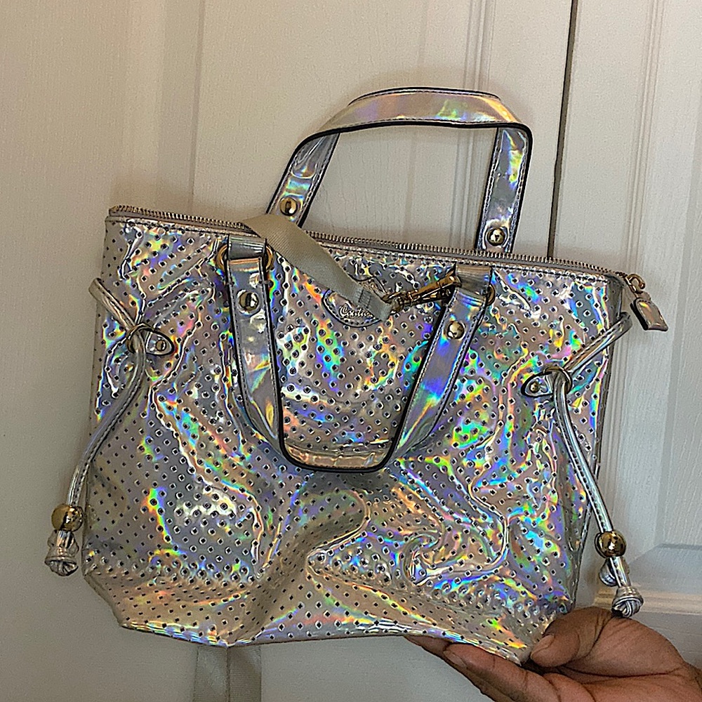 Juicy Couture medium size bag fits mini IPad or 10in tablet. Gently used.